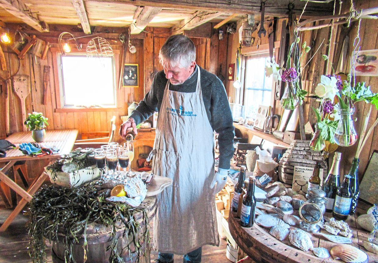 Veteran shucker Karlsson preparing some Swedish aquatic treats like oysters and seaweed for his guests.