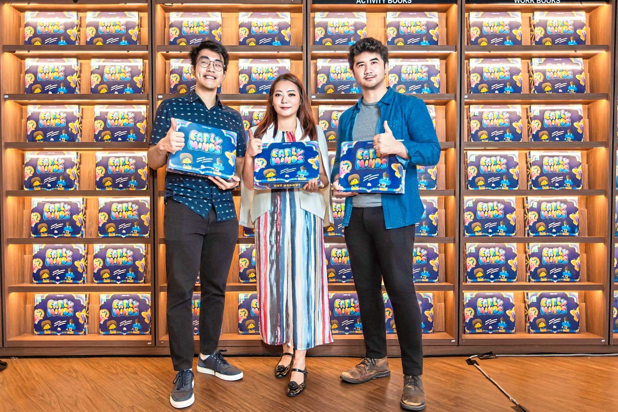 Kee (centre) worked with 1+1 Studio’s Rizal Azlan (left) and Kashif Khairul to develop the card game. Photo: Kee Joey 