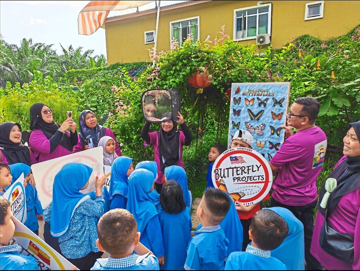 Students visiting Lim’s My Backyard Garden to learn about butterflies.