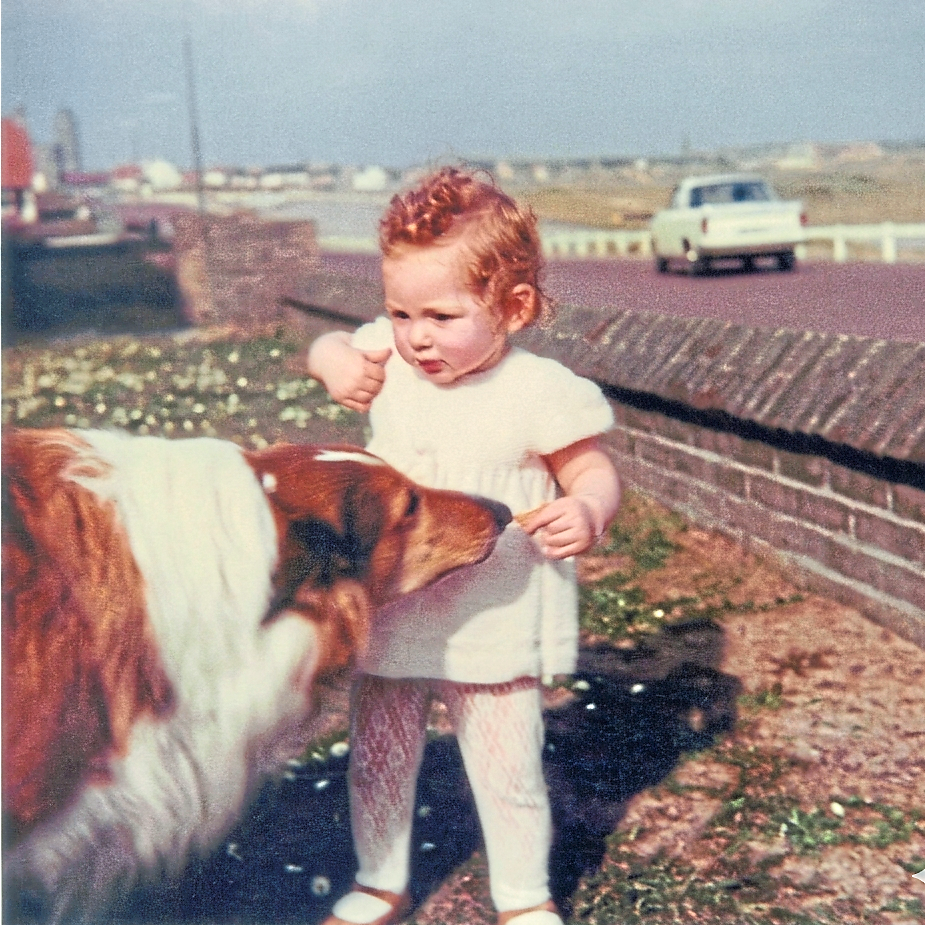 Beppo, the rough collie who often played with the writer (right) on the beach.