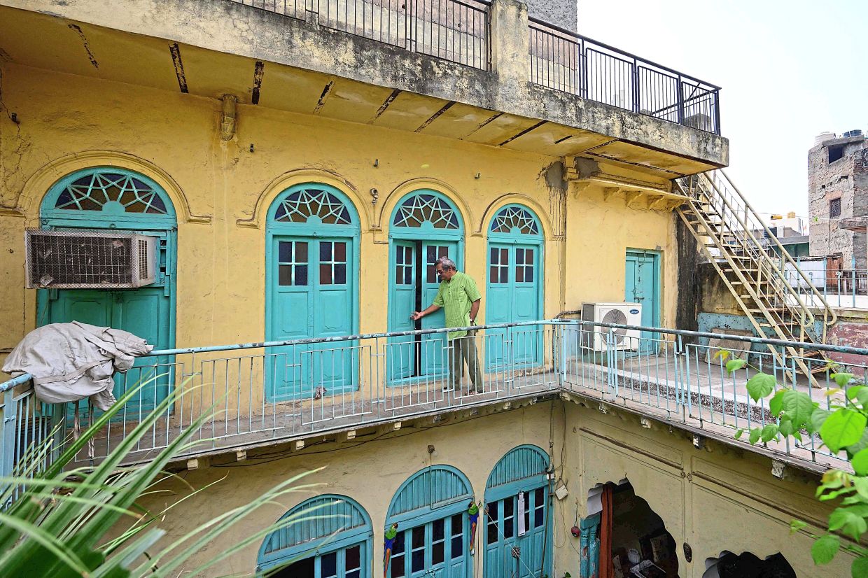 Ashok Mathur, a fourth generation resident walking inside his century-old ancestral property Mathur ki Haveli in the old quarters of Delhi. Photo: AFP 