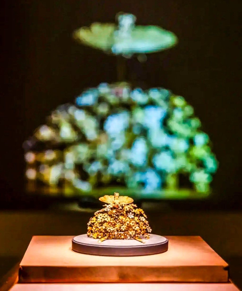 A gold crown, found buried with Li, crafted from wire, sheets, pearls, and gemstones, featured flowers and a moth, symbolising her grandmother’s wish for “many children and lasting prosperity.” - Photo: Courtesy of The National Museum of China