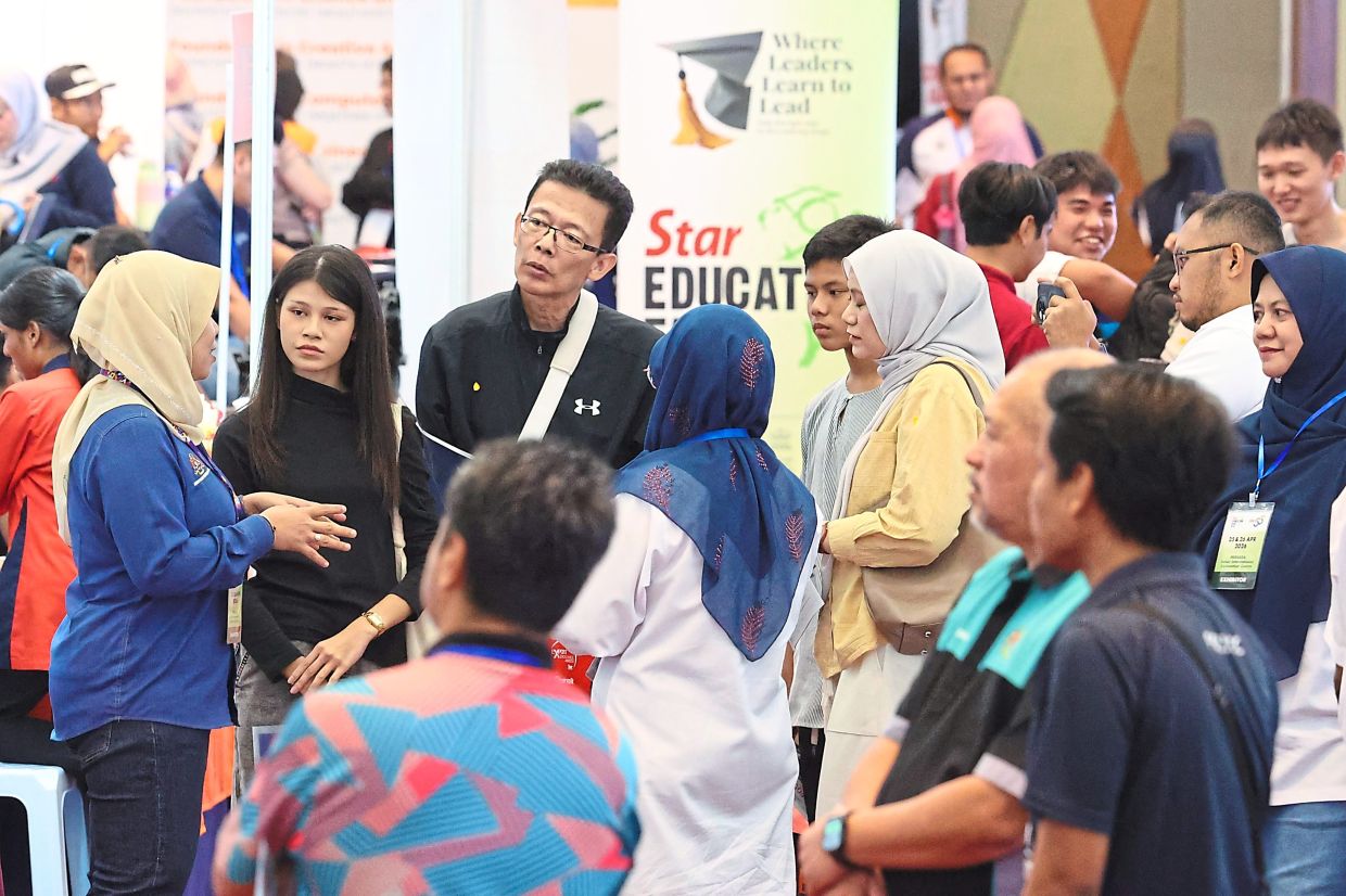Clear guidance: Visitors being briefed at the Star Education Fair 2026 at Persada International Convention Centre in Johor Baru. — THOMAS YONG/The Star