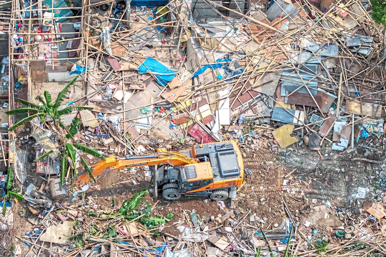 An aerial view showing Nepali authorities demolishing squatter settlements along the banks of the river Bagmati in Kathmandu. — AFP 