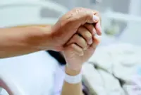 Doctor questions rejection of aid for former nurse's cancer treatment