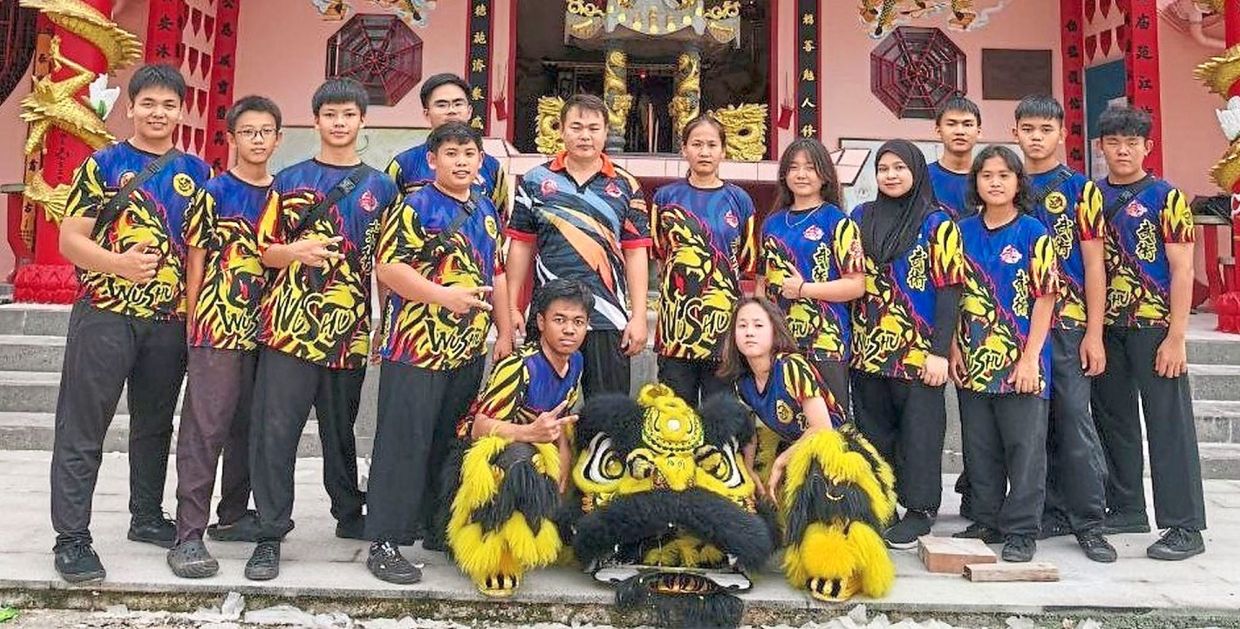 Ho (standing fifth from left) with some members of the troupe.