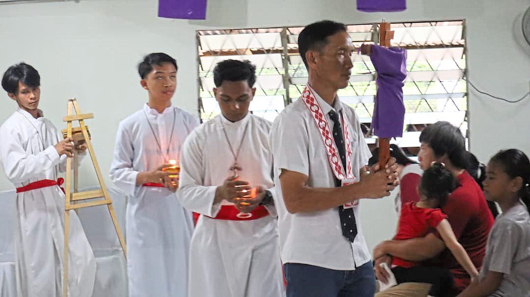 The cross is carried through the church during the observance.