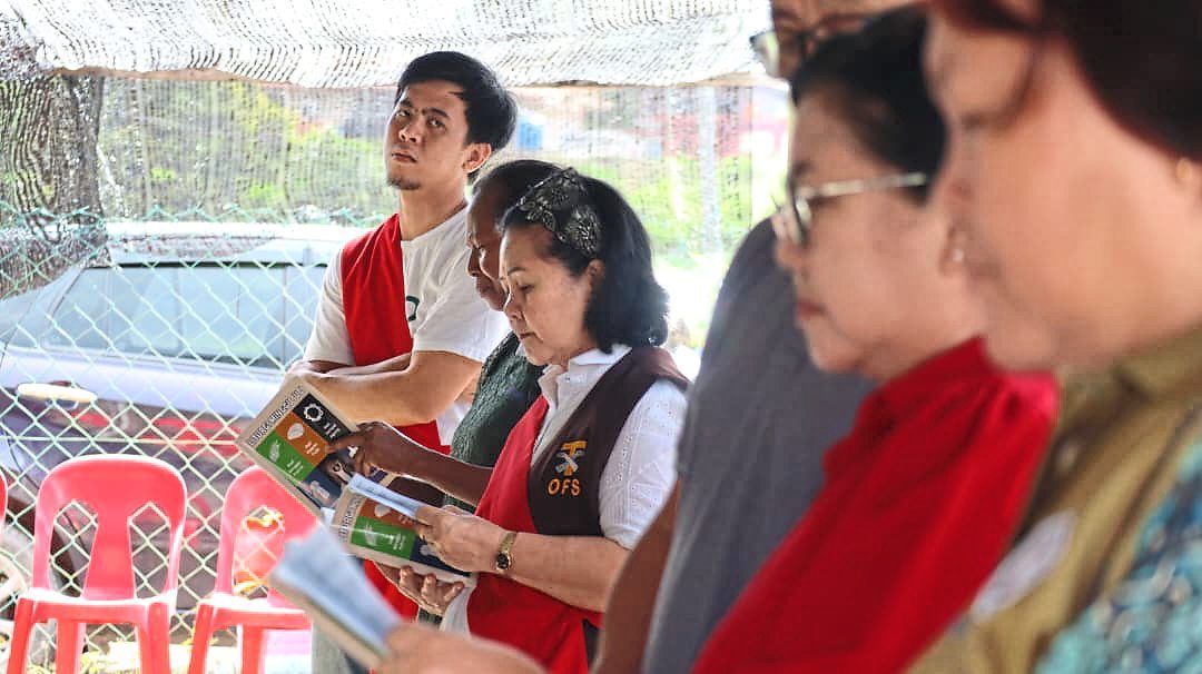 Church members following prayers during the Way of the Cross.