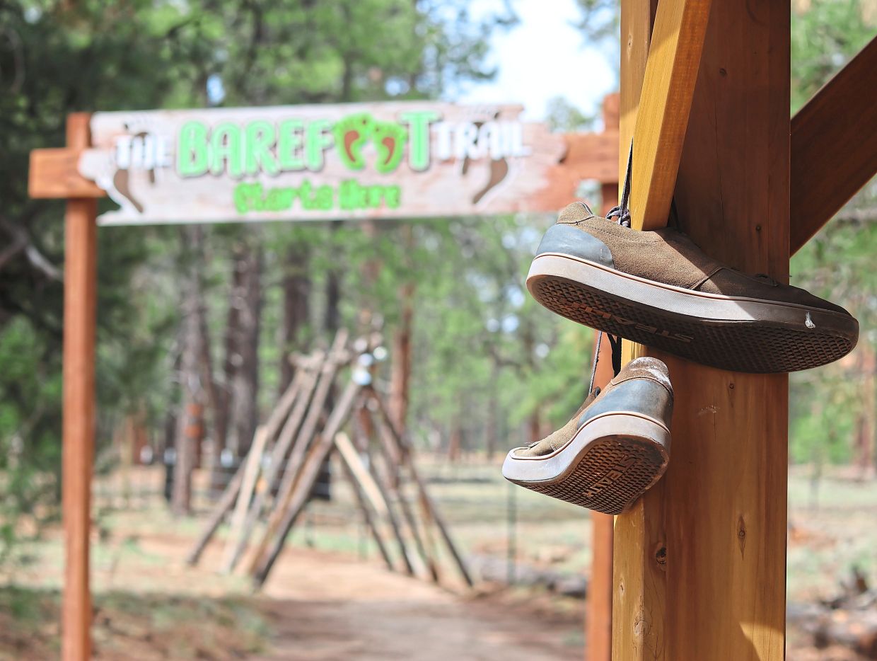 Shoes hanging near the entrance of a barefoot trail in Arizona. Photos: CHEYANNE MUMPHREY/AP