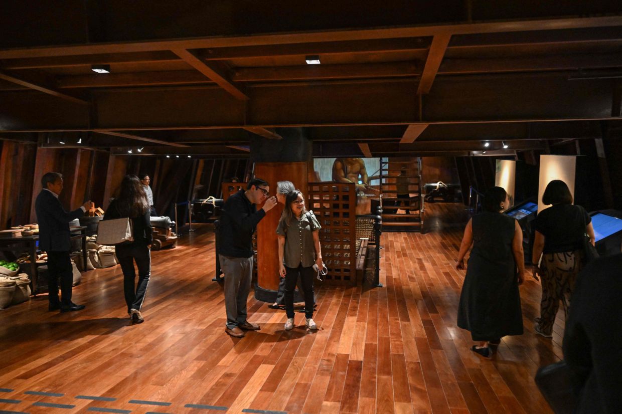 People visiting the Galeon Espiritu Santo which transports visitors back to the 17th century, when conscripted Philippine mariners birthed the era of globalisation. - AFP