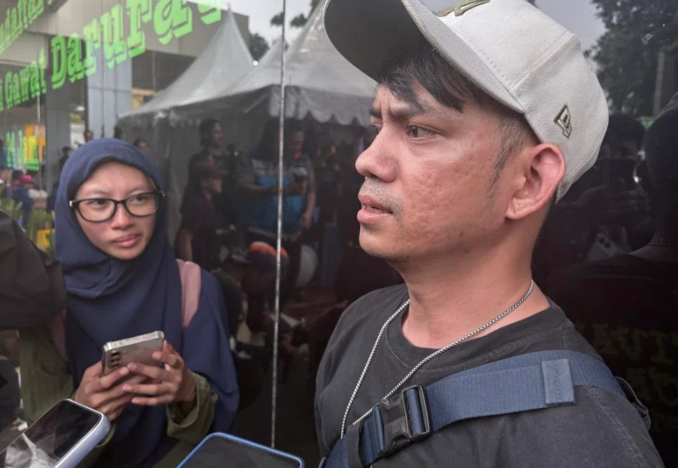 Muhammad Iqbal, 32, whose cousin Endang Kuswati was stuck in the crushed train carriage for around 10 hours before being rescued. - ST PHOTO: KARINA TEHUSIJARANA