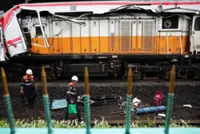 Indonesia train crash toll rises to 14 as rescuers work to remove trapped passengers