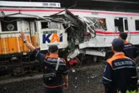 Taxi firm faces probe after Indonesia train crash kills 15