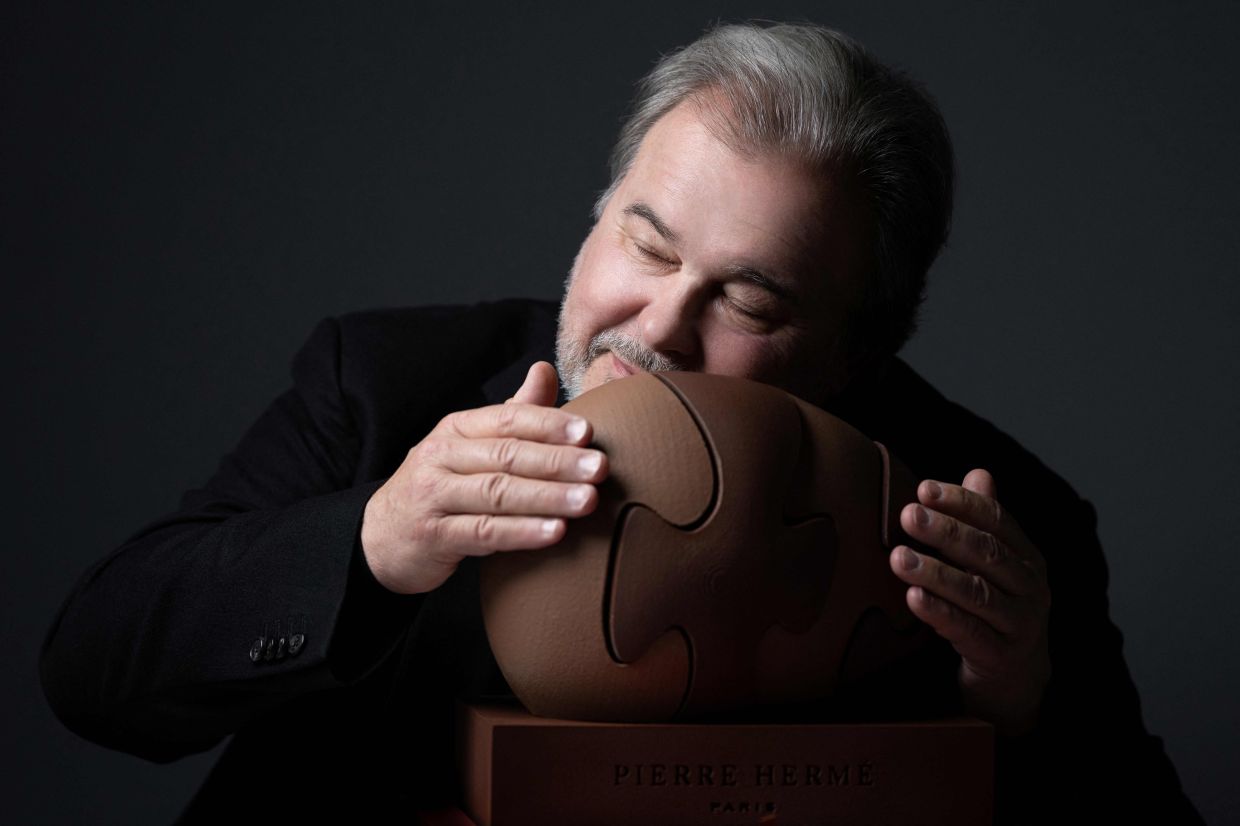Pierre Herme, the French master of macarons, says he was inspired to build his multi-country empire selling the sugary French treats by a desire to reinvent an object he felt was boring.