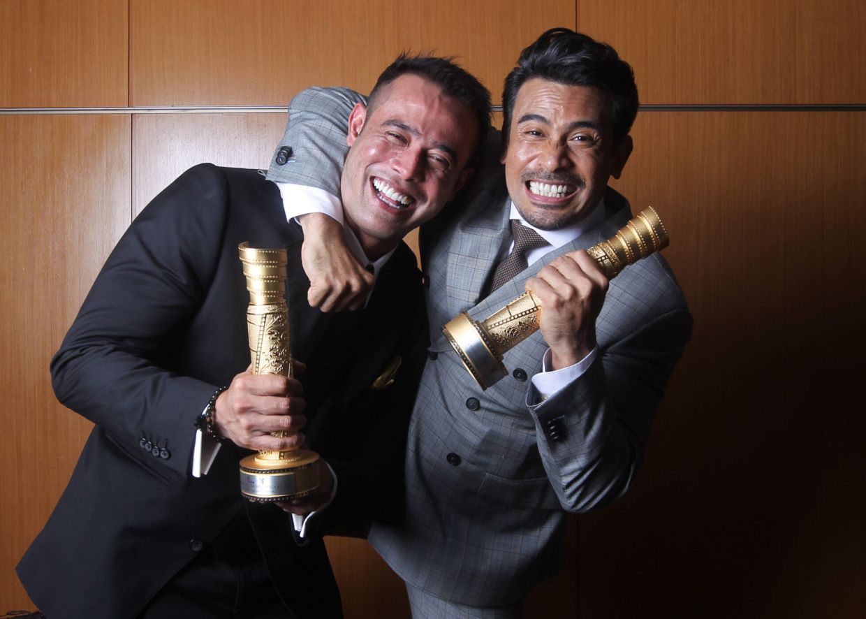 Celebrating his win at Malaysia Film Festival with 'Sangkar' co-star, Zul Ariffin. Photo: Handout