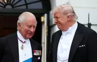 As Trump greets Charles, the White House calls them 'TWO KINGS'