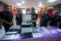 Terengganu cops bust MyKad forgery ring