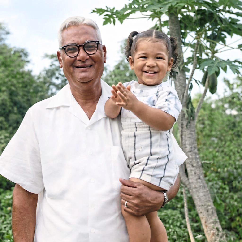 The author (right) and her grandfather, T. Chelliah, whom she describes as a traditional Ceylonese man who loved hand-made food. 