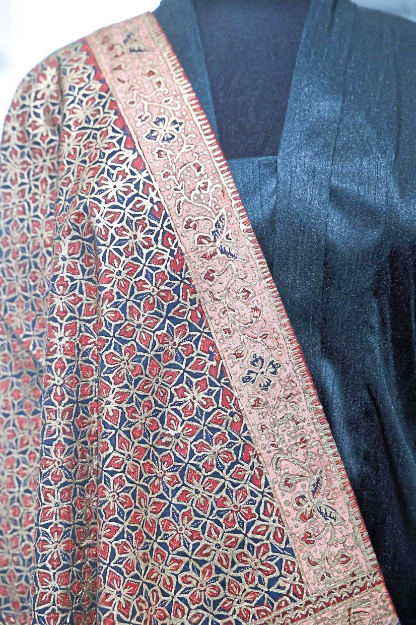 A 19th-century ‘telepuk’ shawl on display during the Busana: Traditional Costumes of the Malay World exhibition at Islamic Arts Museum Malaysia. — Filepic