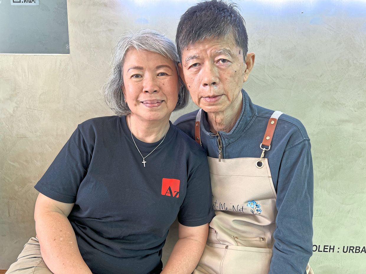 Doris (left) is proud of her husband, CP, for managing to serve and take orders. Photo: The Star/Natasha A.