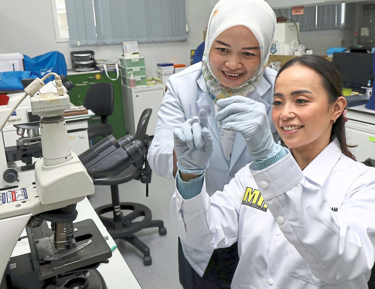 Adela (right) works closely with her colleague, medical lab technologist Dayang Izyan Hazwani Zziz, 31, on tackling infectious diseases in Malaysia.