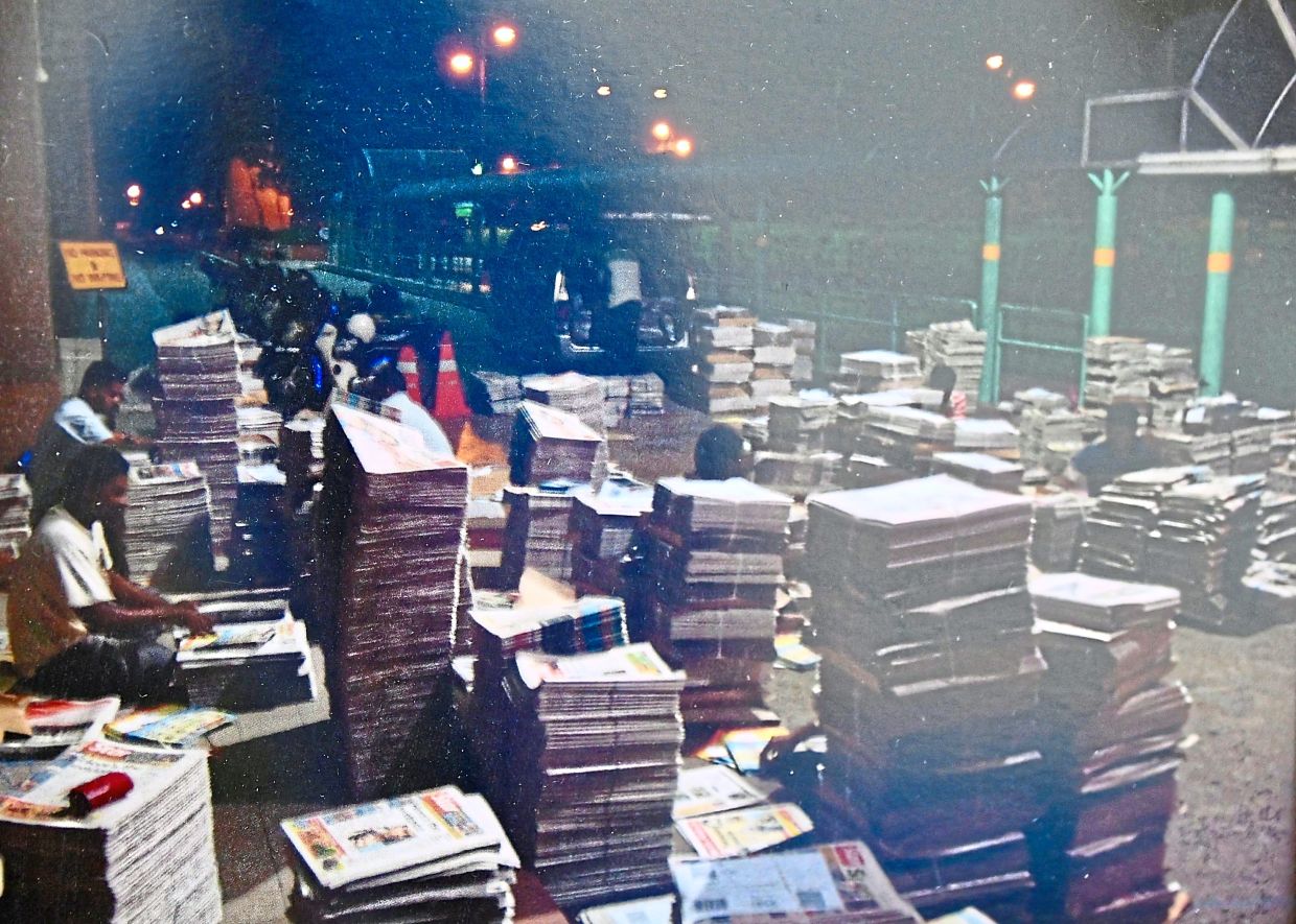 Back in the 1990s, thousands of newspapers were sorted in the early hours at a drop point in Petaling Jaya, Selangor before delivery. Photo: Saravanan Manickam