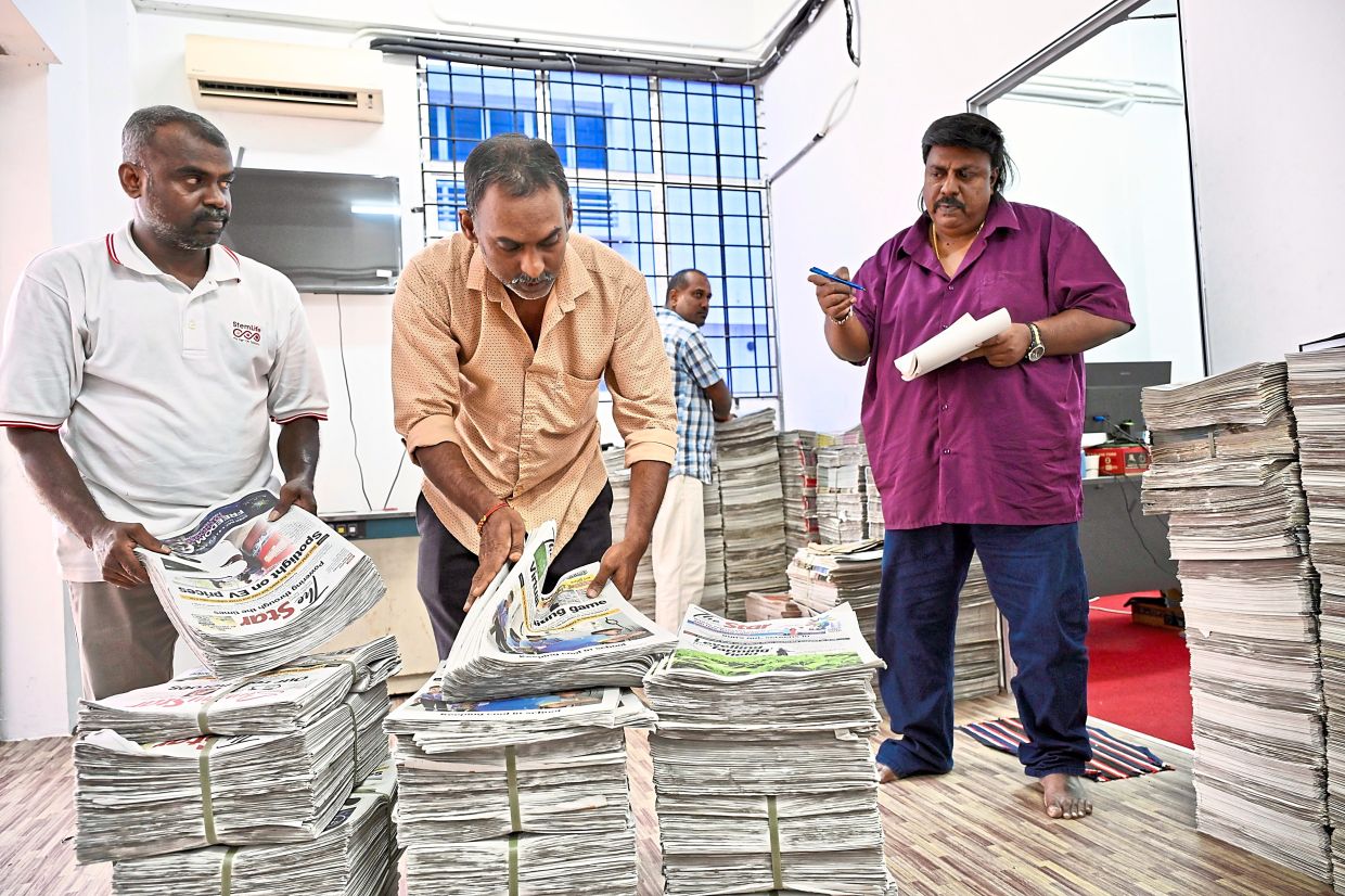 Saravanan's (right) passion for the trade is rooted in his upbringing, having been immersed in the newspaper business from young.