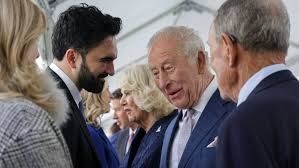 The monarch was seen laughing with Mamdani and having a brief conversation after they shook hands.