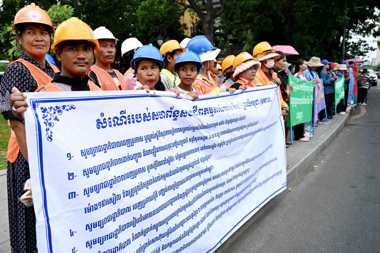 Cambodian workers attend a protest to mark International Labour Day in front of the French embassy in Phnom Penh on Friday. May 1, 2026. -- Photo by TANG CHHIN Sothy / AFP)