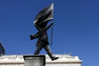 Banksy installs statue of flag-wielding man in central London