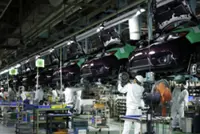 Japan's factory activity growth hits 4-year high on stockpiling, PMI shows
