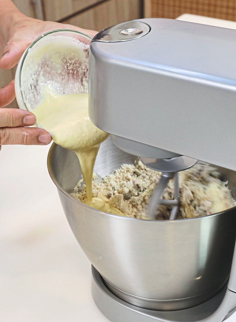 Incorporate rehydrated cranberries and toasted pumpkin seeds into the dough before adding the sour cream and egg mixture.