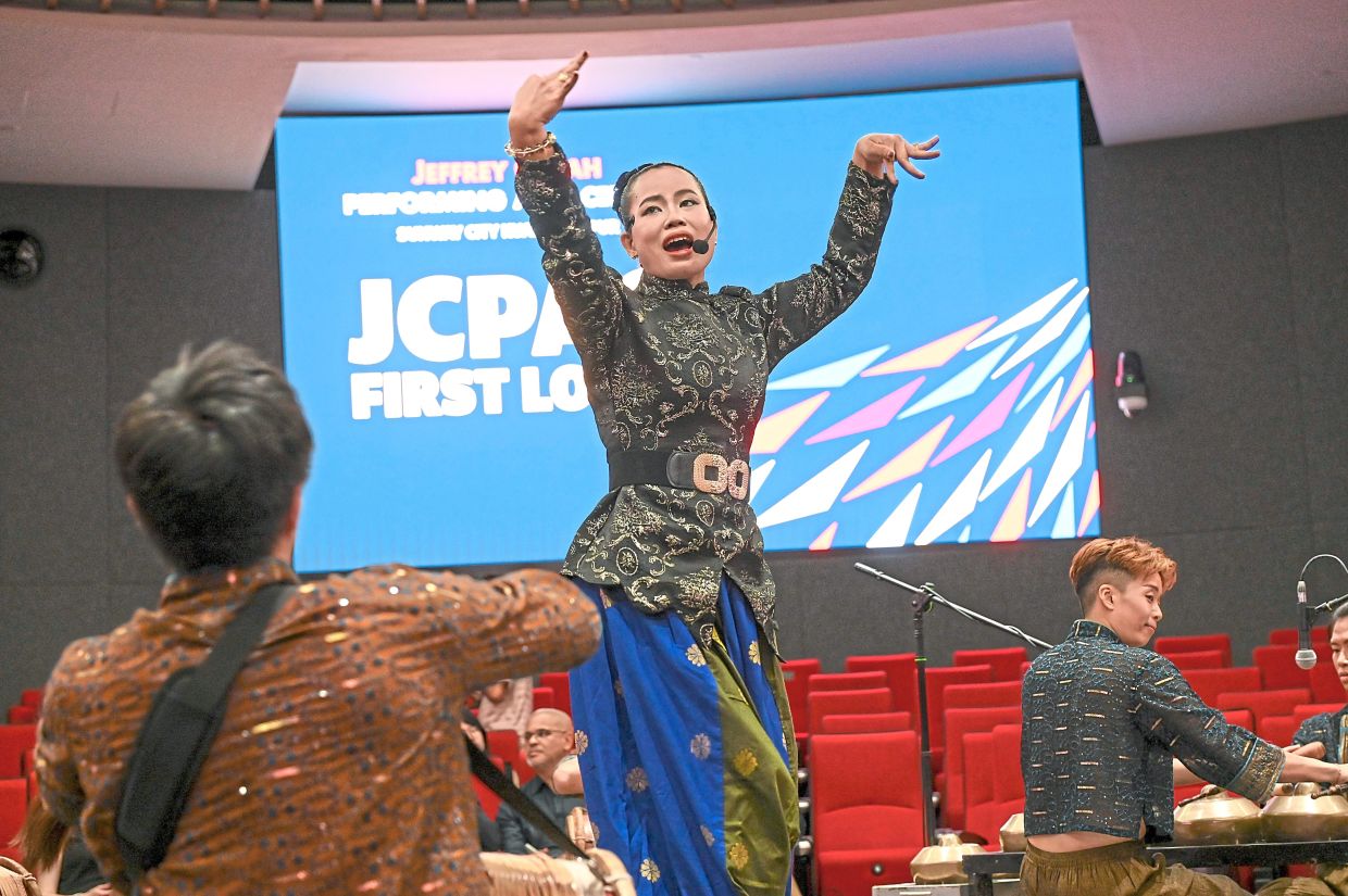 Zamzuriah performing a traditional Kelantanese dance. 