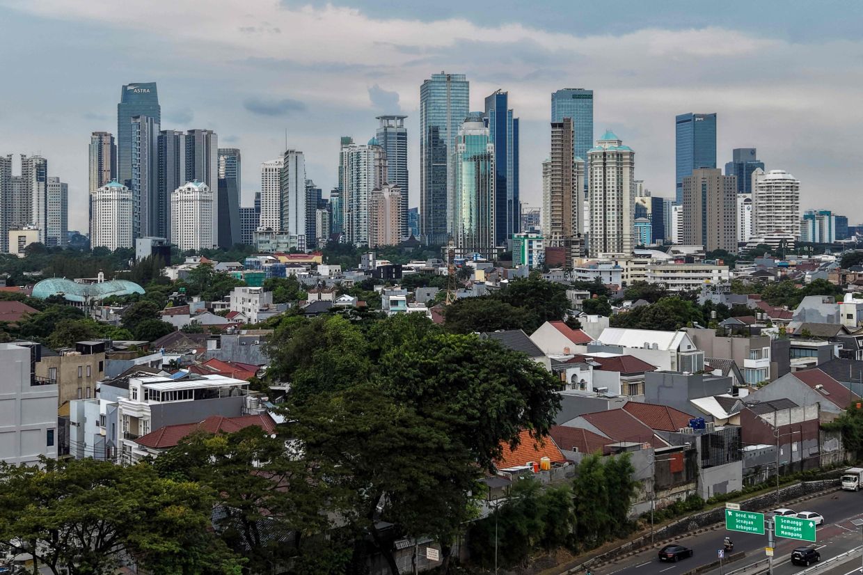 This picture shows an aerial view of Jakarta's skyline, -- Photo by BAY ISMOYO / AFP