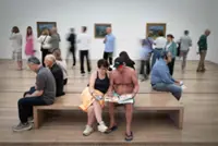 Immersive art: museum-goers in bikinis dive into Cezanne