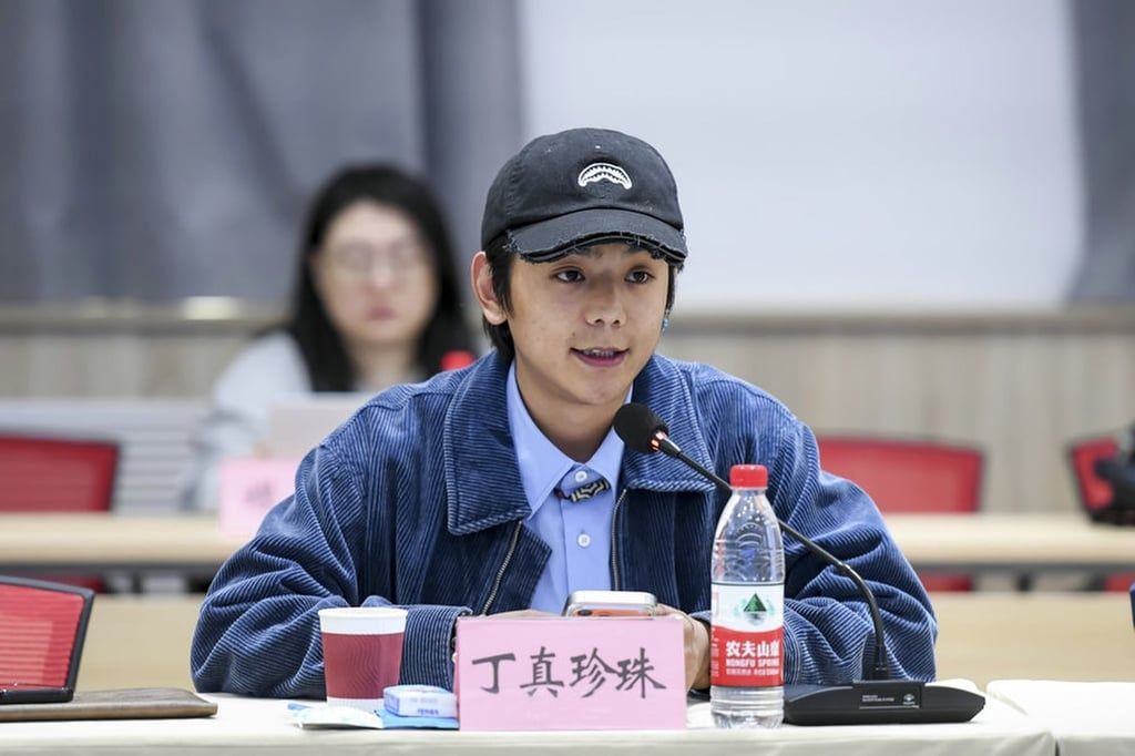 Ding, above, speaks as part of his role as a tourism ambassador. -- Photo: Sina