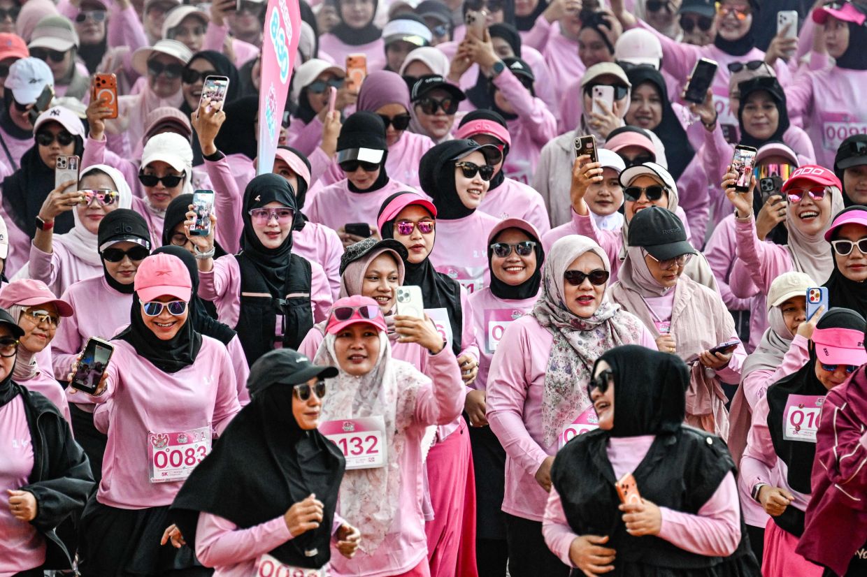 Women runners take part in a - She Runes the World - event at Harapan Bangsa stadium in Banda Aceh on Sunday, May 3, 2026. -- Photo by CHAIDEER MAHYUDDIN / AFP