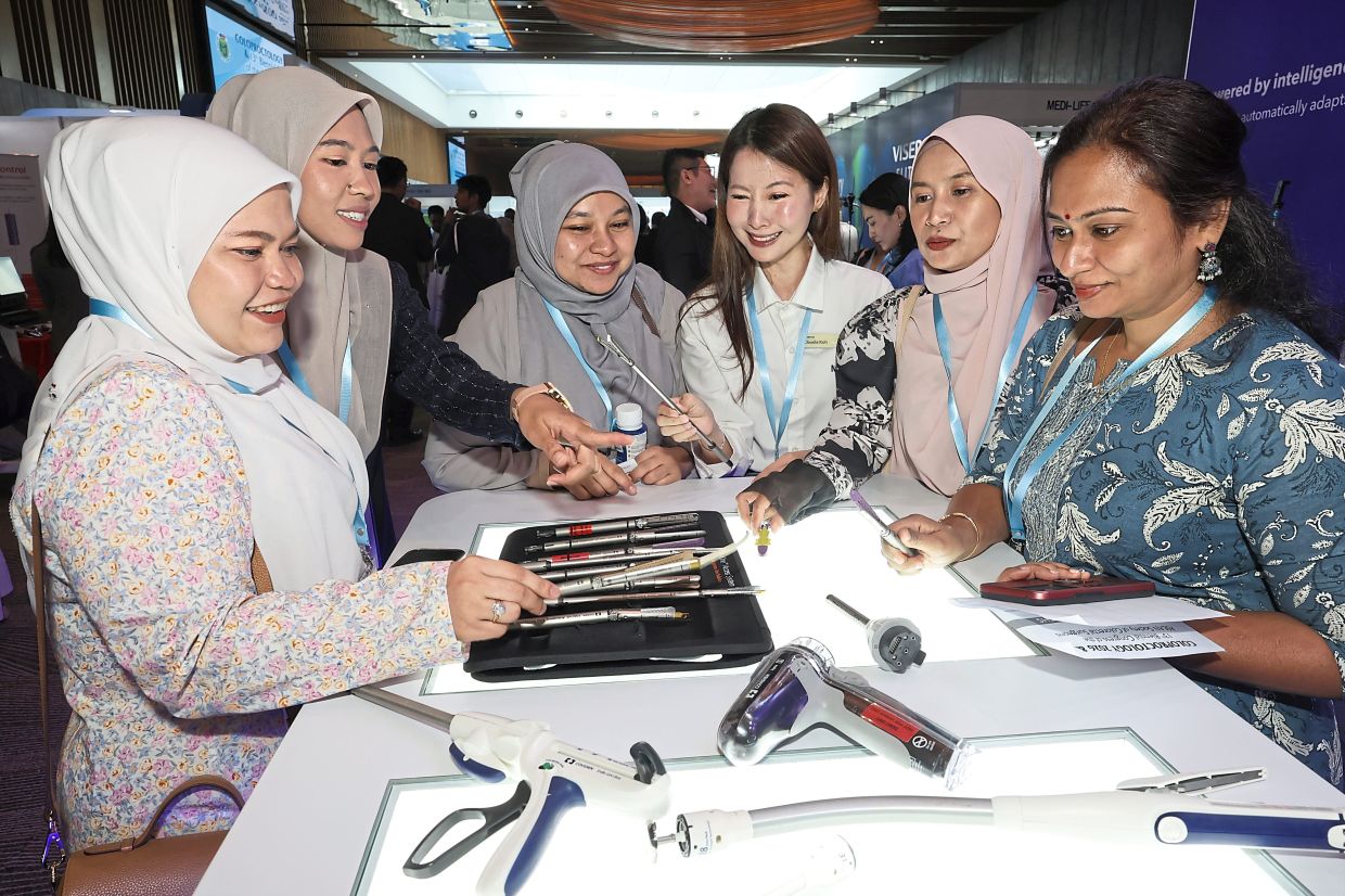 Visitors at a booth set up in Setia SPICE Convention Centre during the coloproctology conference.