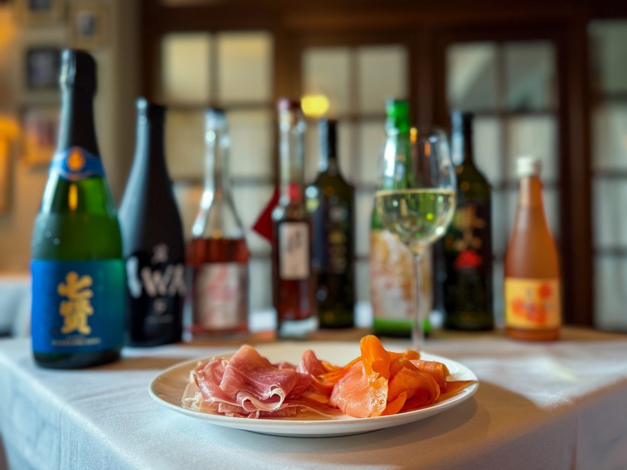 Sake has a slew of tastes so matches multiple dishes. Here, served with Parma ham and smoked salmon. Photo: Claudia Wittke-Gaida/dpa-tmn