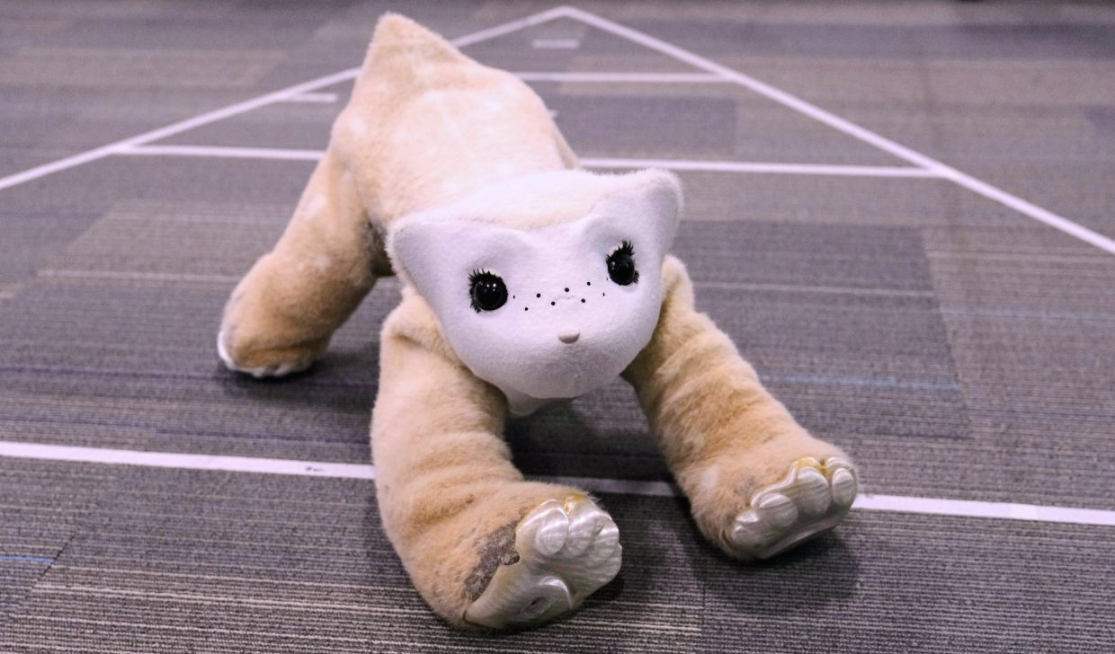 Imagine a creature the size of a bulldog with doe-like eyes and bear cub ears and paws, extending itself into a greeting stretch that invites you to pat its touch-sensitive fake fur.