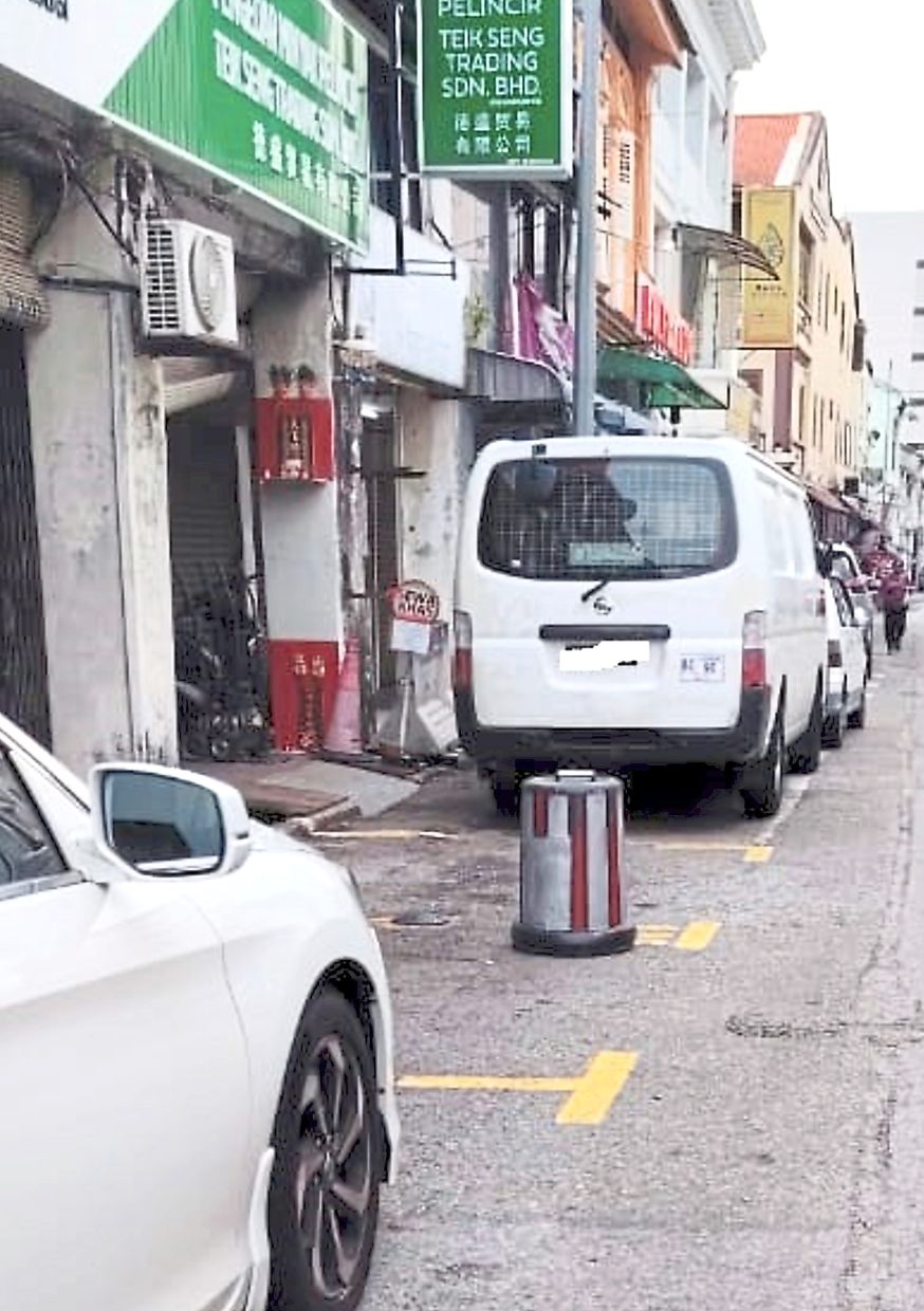 An object is used to illegally reserve a city council parking bay in China Street. —Handout