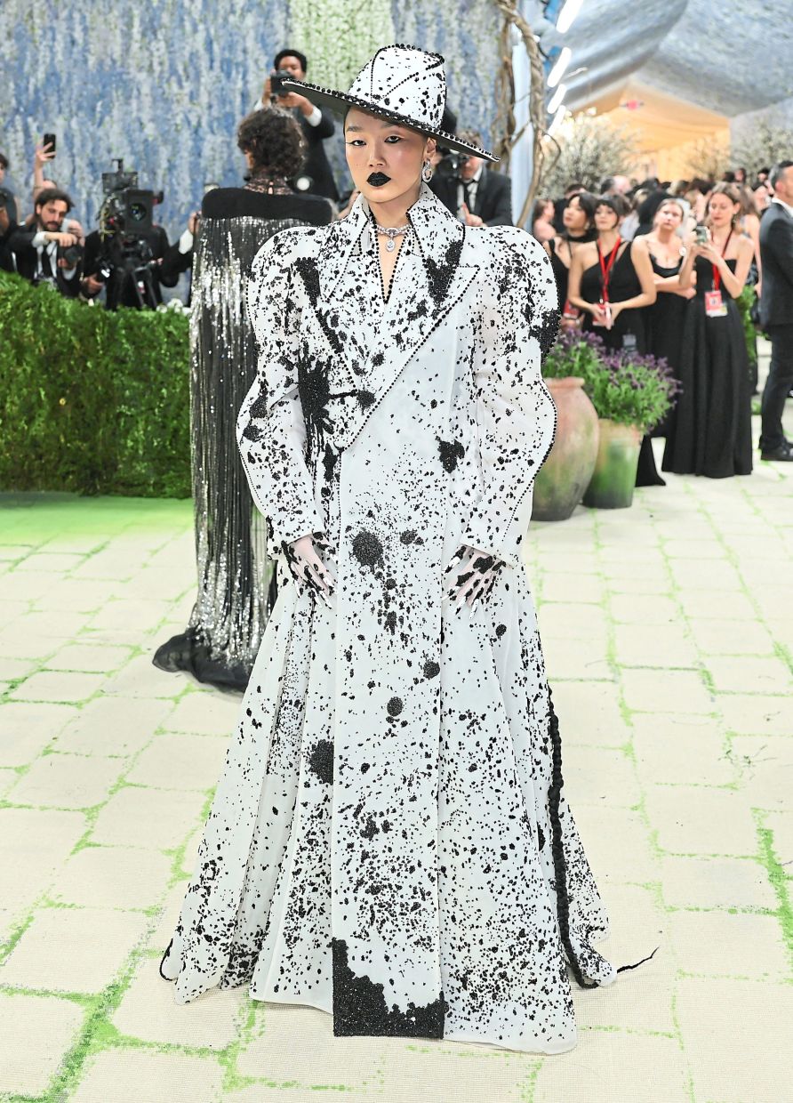 Audrey Nuna wears a creation that appears to be a metaphorical white canvas splattered with ink. Photo: Reuters