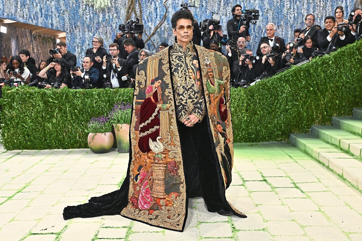 Karan Johar in a painting-inspired, embroidered ensemble. Photo: AP