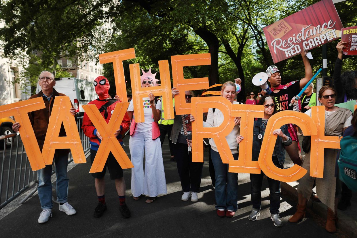 Protesters gather blocks away from where the Met Gala is being held. Photo: AFP