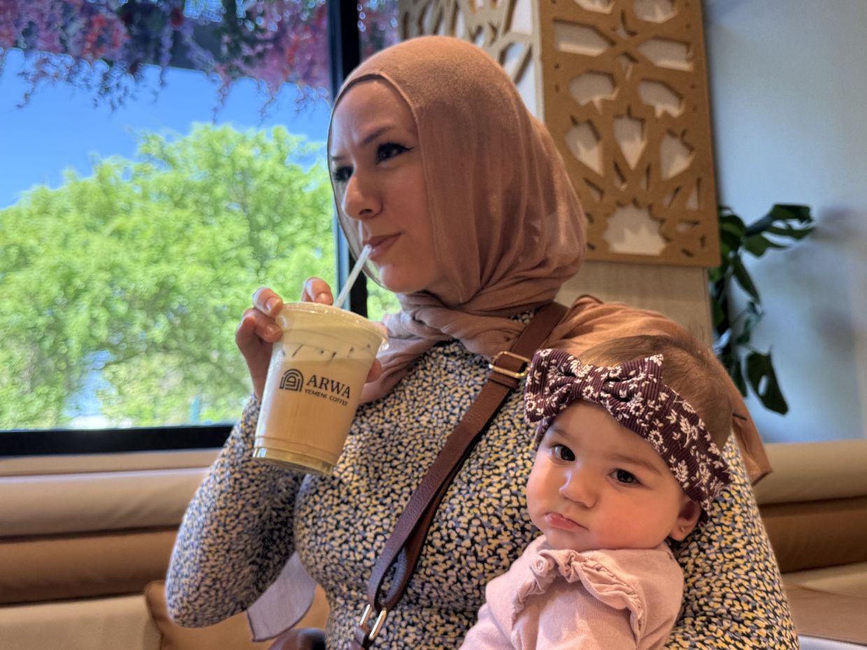 Hanan Jomaa drinks an iced pistachio latte inside Arwa Yemeni Coffee onApril 6, 2026 in Sunnyvale, Calf.(AP Photo/Haven Daley)