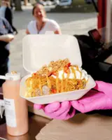 What are jacket potatoes, and why are the English waiting hours for them?