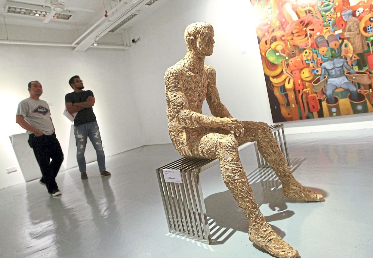 Samsudin's 'Orang Ikan Kering' (variable dimension, dried fish, fibreglass, wire match, 2015) installation work, which was part of the 'Flush' exhibition at G13 gallery in Petaling Jaya in 2015. Photo: The Star/Filepic