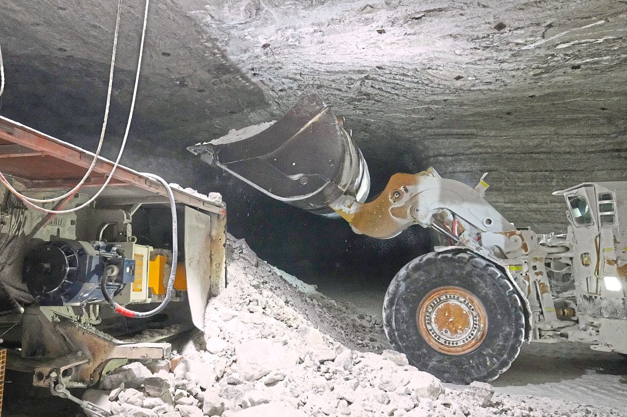 The salt, formed 440 million years ago, is mucked up and loaded onto a conveyor belt.
