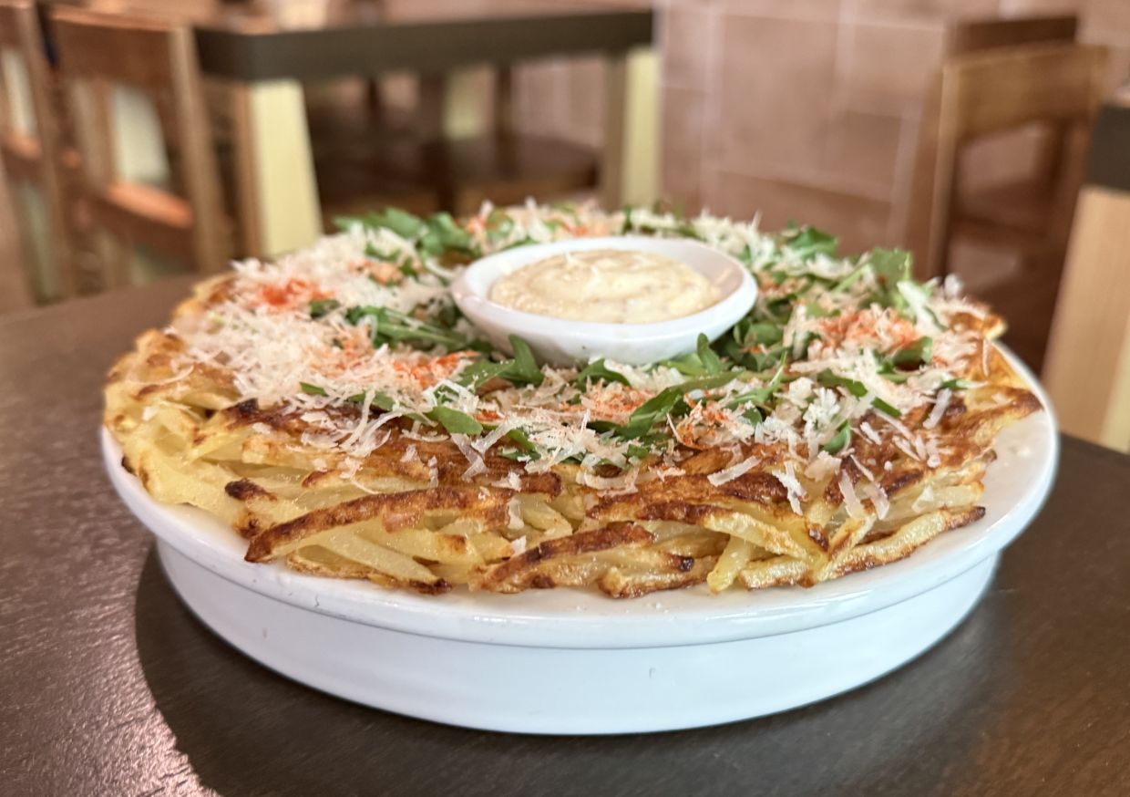 Crispy potatoes, prawns and grated cheese form the bedrock of this addictively good potato pancake.
