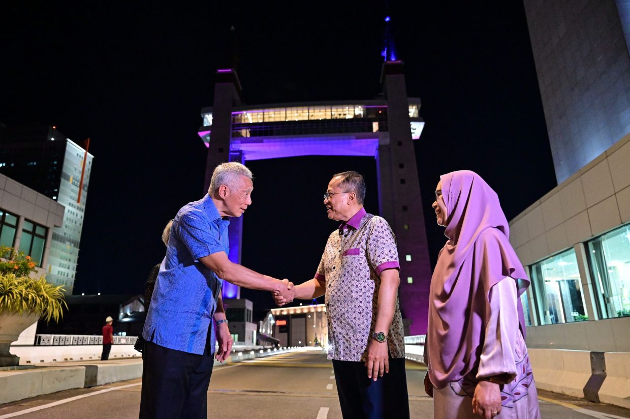 Shortly after arriving at 8.15pm, they were greeted by a flotilla of 40 fishing boats decked in colourful lights at Sungai Terengganu estuary.